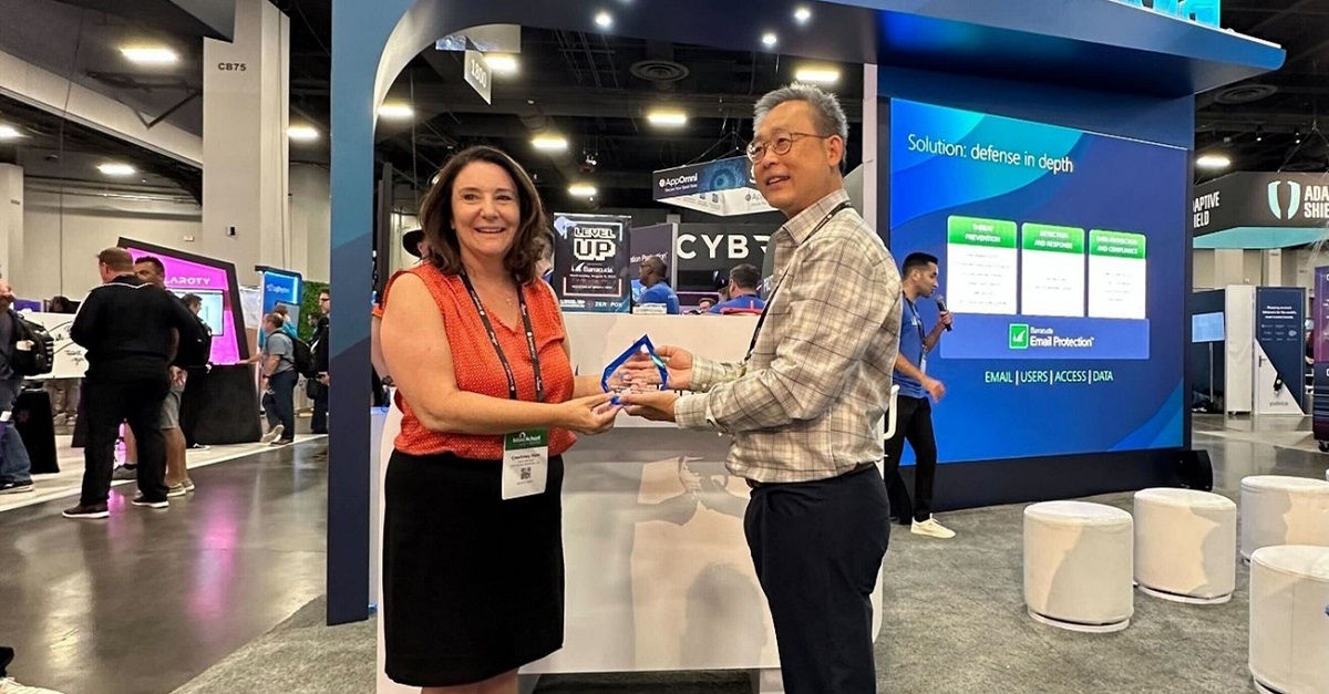 Diane Honda accepting an award at the Barracuda booth at Black Hat USA 2023